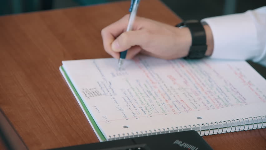 Man Writing in Notebook Royalty-Free Stock Footage #1008352390