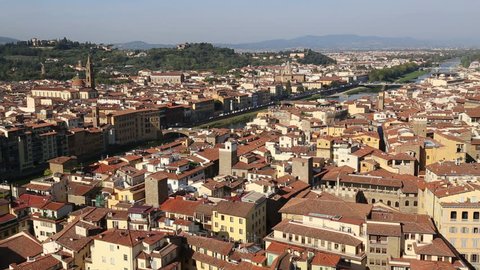 Cityscape of Florence, Italy, with the river Arno and the hills of Tuscany beyond
