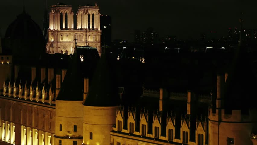 Aerial discovery of Notre-Dame de Paris cathedral (before the fire) shot by night in Paris city, France. Royalty-Free Stock Footage #1008369604