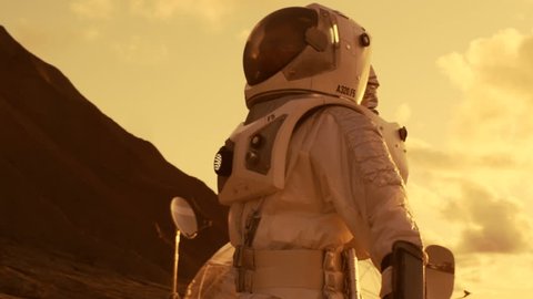 Following Shot of the Astronaut On Mars Walking Toward His Base/ Research Station, Looking Around. First Manned Mission To Mars, Technological Advance Brings Space Exploration, Colonization.