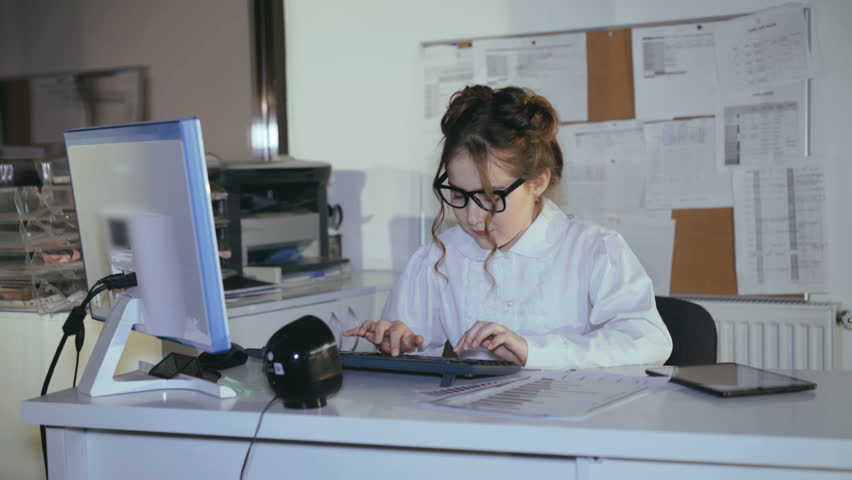 Young girl willingly typing on keyboard then dreaming with smile at workplace. 4K | Shutterstock HD Video #1008384235