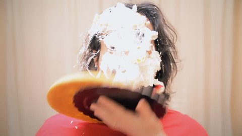 An extrovert man receives a whipped cream pie in the face while dancing. Funny classical slapstick comedy gag.
