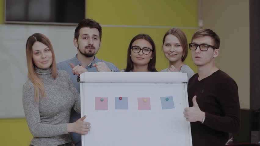 internatonal students enjoying the results of a team work next to flip chart after training Royalty-Free Stock Footage #1008416287
