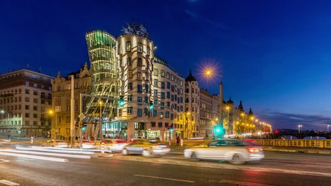 PRAGUE, CZECH REPUBLIC - DECEMBER 26, 2017: Dancing House (called Ginger and Fred), designed by Vlado Milunic and Frank O. Gehry in Prague at evening, Czech republic. Timelapse view, 4K.