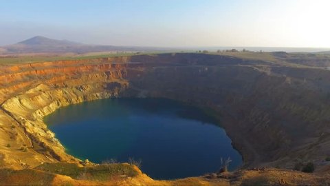Flying into an abandoned mining crater creating a vertigo effect