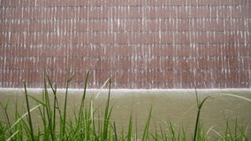 Brown Wall Waterfall movement with the leave  foreground in the park