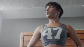 mixed rae african american woman has a rest during her workout breathing deep slowmotion soft light video