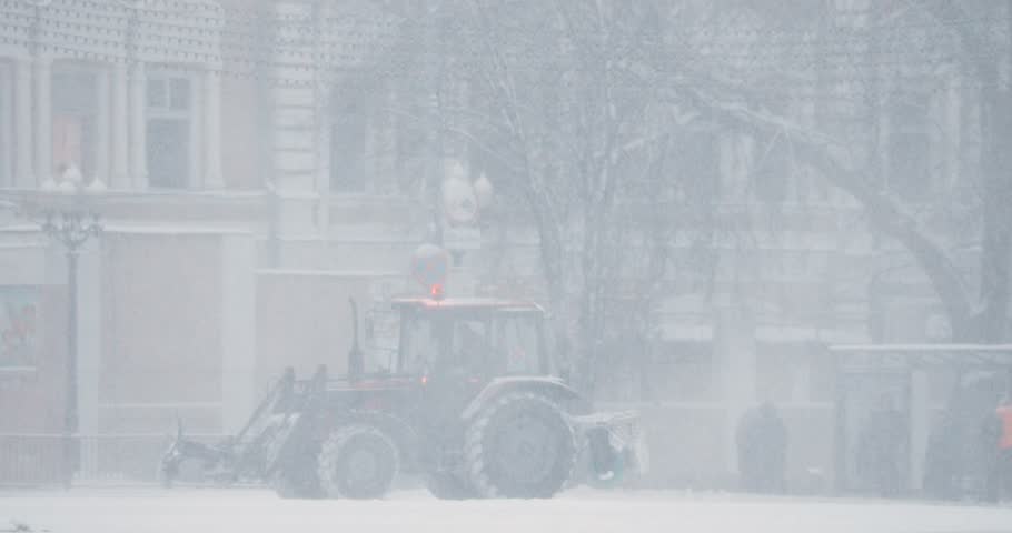 Gomel, Belarus. Tractor Cleaning Snow In Winter Snowy Snowstorm Day. Pan, Panorama.