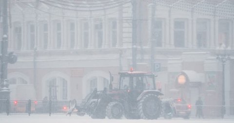 Gomel, Belarus. Tractor Cleaning Snow In Winter Snowy Snowstorm Day. Pan, Panorama.