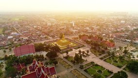 
4k Video shot aerial view by drone of Wat Phra That Luang , Vientiane, Laos PDR. sunrise on Lao landmark temple.