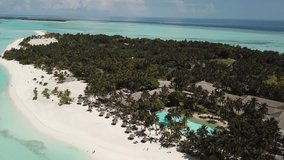 Aerial Drone footage view of island crystalline sea in Maldives // no video editing
