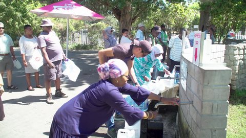 Cape Town, South Africa - 25 February 2018 : Residents of Cape Town, South Africa are forced to queue for water around the city, as a crippling drought threatens the city's water supply.