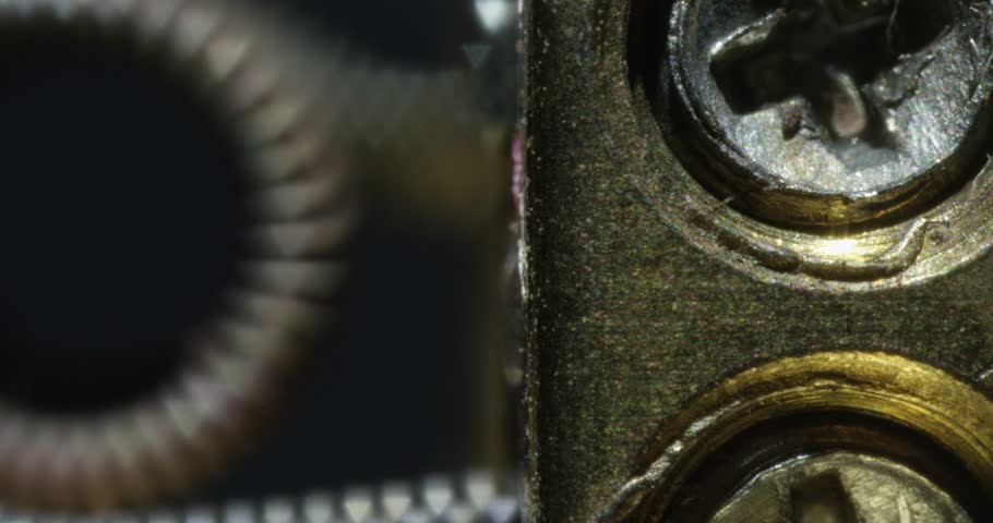 Macro shot of a guitar string, gears on a guitar fret board. 4K. Micro.