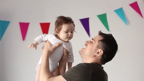 Father have a fun time with a child at home
