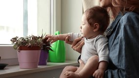 Mother teach a little baby love to herbs and plants.