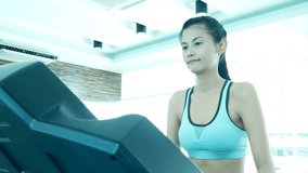 Asian woman exercise with training machine at gym. Woman with exercise concept. 