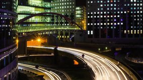 Time lapse zooming of Paris modern buildings, dynamic urban street traffic, car lights in business district. Night cityscape with glass facade skyscrapers. Evening jam, economics, finance concept - Powered by Shutterstock - Get 15% off with code: PIKWIZARD15