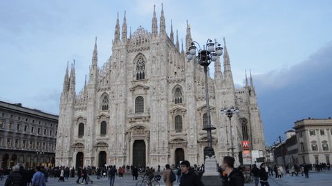Milan, Italy - March 2018: Piazza Duomo with people. Pan of the central square