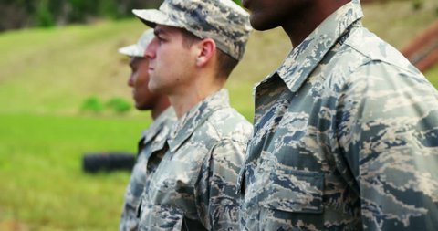 Group of military soldiers standing in line at boot camp 4k