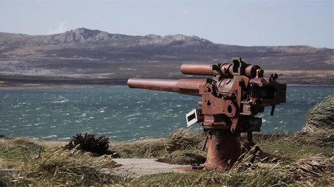 Old Cannon on the Rocky Coast of Falkland Islands, Remains of British QF 4-inch Mark IV naval gun (WWII), Gypsy Cove near Port Stanley, Falkland Islands (Malvinas).