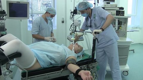 Ukraine.Kiev.28.02.2018.medicine. gynecology. nurses prepare a woman for an operation on female genitalia. a woman with her legs apart lies on the gynecological table in the operating room.anesthesia