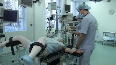 Ukraine.Kiev.28.02.2018.medicine. gynecology. nurses prepare a woman for an operation on female genitalia. a woman with her legs apart lies on the gynecological table in the operating room.anesthesia