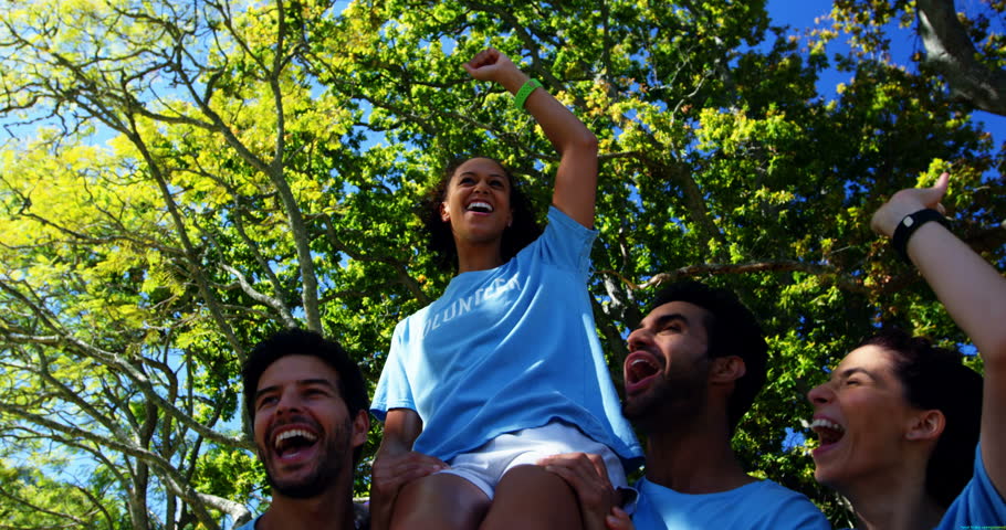 Volunteers having fun in park on a sunny day 4k
