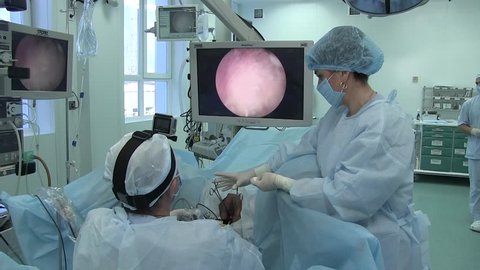 Ukraine.Kiev.28.02.20018. medicine.the surgeon performs an operation on the labia in a woman in a gynecological chair. operating table. surgical hysteroscopy operative interventions inside the uterus 