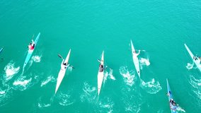 Aerial drone bird's eye view video of sport canoes and kayaks in competition over tropical sapphire clear waters