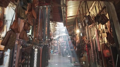  Flare and light rays in the souk of Marrakech Morocco where people sell typical and traditional home made commodities moving forward