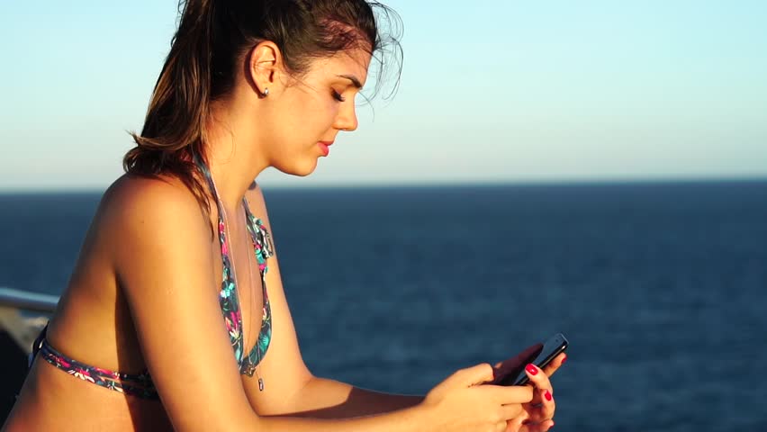 Woman using mobile at Cruise Ship Vacation