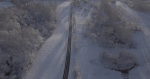 4K Flying Above Snow Covered Trees 24