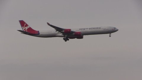 LONDON, ENGLAND - March 11, 2018 - A Virgin Atlantic Airways Airbus A340 aircraft landing at London Heathrow airport.