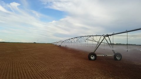 Pivot irrigation used to water plants on a farm. Circling pivot irrigation with drone
