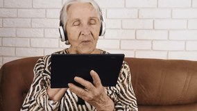 Video call. The elderly communicates on the Internet.