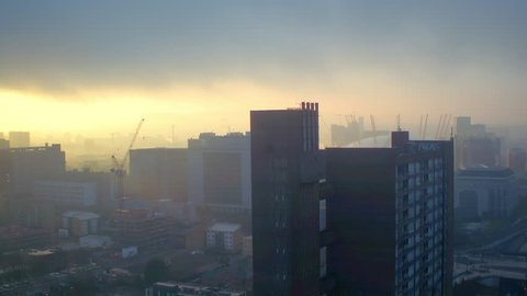 Drone shot of London O2 arena at sunrise on a foggy morning