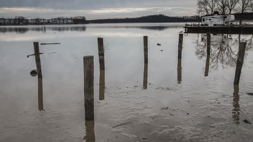 Time lapse of clouds and low tide on the Bush River in Abingdon Maryland.  Taken from the Bar Harbor RV Park and Marina.  The movement of the clouds gives the appearance of mist or smoke on the water.