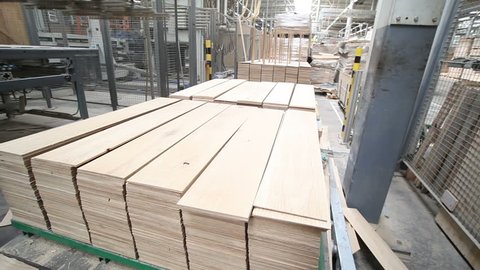 VINNITSA, UKRAINE - february 2018: Industrial equipment for the production of laminate. Laminated flooring.The factory for the production of laminate.
