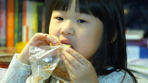 Toddler eating crackers