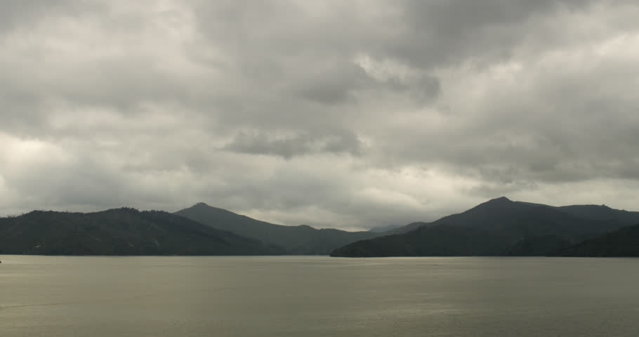 Moving shot of beautiful New Zealand mountain landscape under cloudy sky