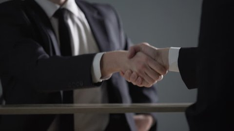 Partnership agreement based on corruption, business handshake in illegal deals