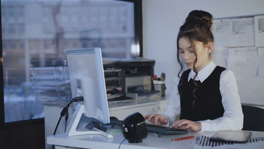 Young female teen working with pc and tablet in office. 4K | Shutterstock HD Video #1008579298