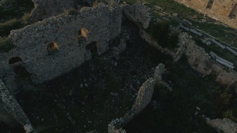 View at the beautiful Mediterranean sea from ruined Syedra Castle walls on green Taurus Mountains during the sunset in Antalya Province, Turkey. Slow motion, 4k.