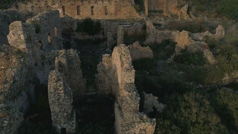 Aerial drone flight. Close-up view of the ruined Syedra Castle during the sunset. Antalya Province in Turkey. 4k, Slow motion.