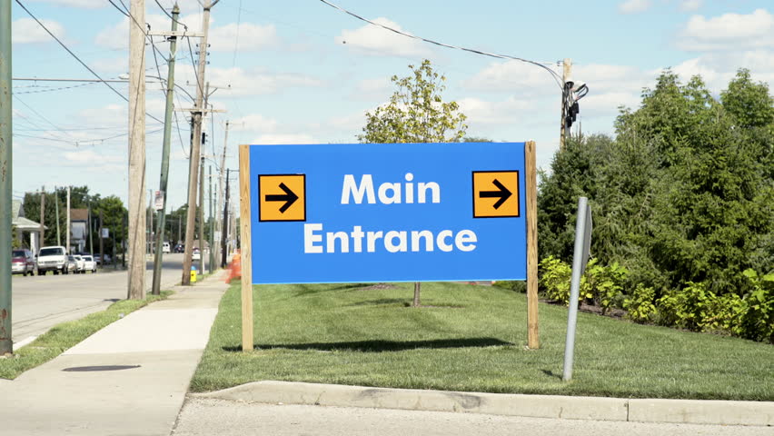 Main entrance sign on side of road 4k