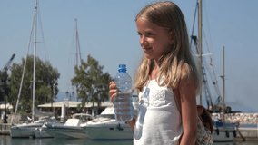 Child Drinking Water on Beach Seaport, Happy Tourist Girl in Summer Vacation 4K