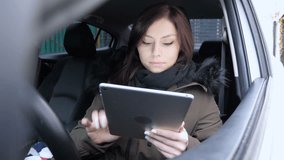 Online Web Video Chat by Woman Sitting in Car, Tablet