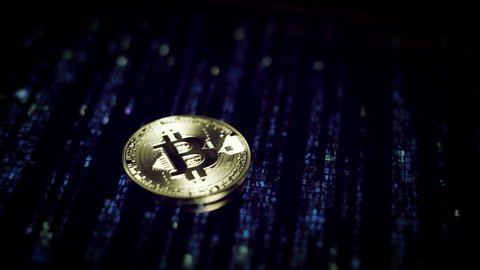 4k Close-up of Bitcoin on Coding Background, Cryptocurrency