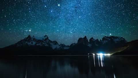 Torres del Paine National Park at night, timelapse with reflexion in the lake of Pehoe, Chile