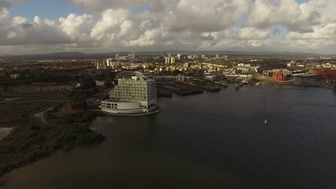 Cardiff bay Aerial, wide shot of water edge with Cardiff Millennium Stadium and surrandings